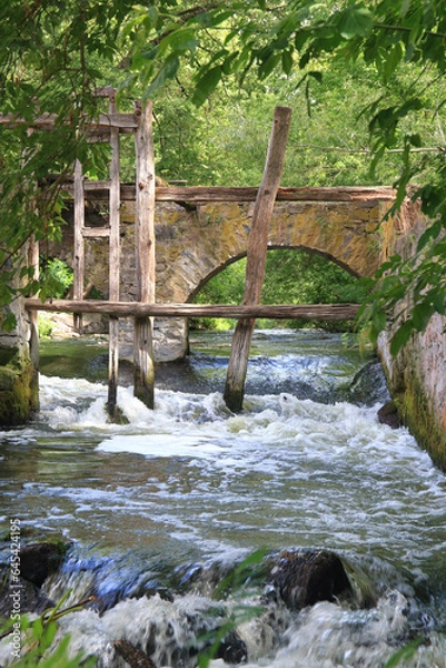 Obraz Old destroyed bridge on the river.