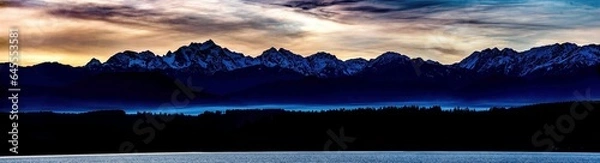 Fototapeta sunset over the mountains