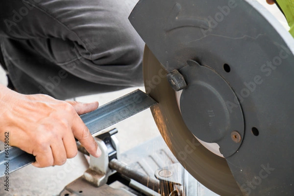 Fototapeta Worker are grinding steel