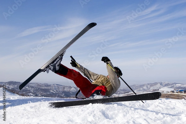 Obraz Snow Skier Jumping Against Blue Sky