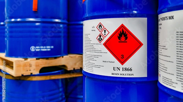 Obraz Blue 200 liter chemical and oil drums arranged on pallets. Stored in an orderly warehouse. to wait for delivery