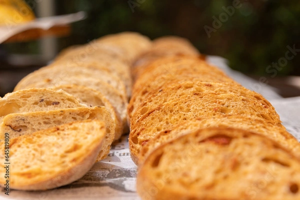 Obraz sliced ​​bread lies in two rows on the table