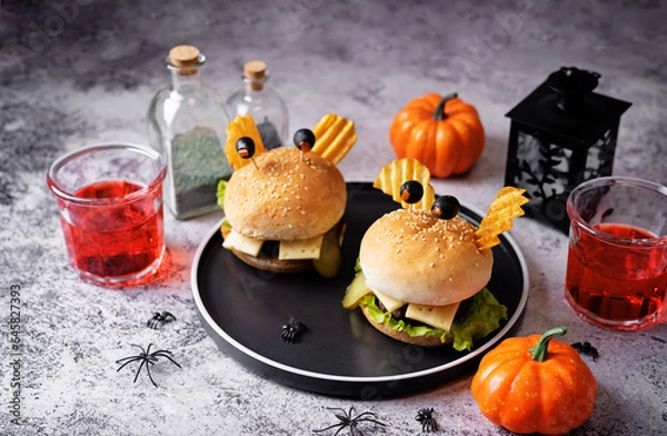 Fototapeta Meat burger in the form of funny monster for Halloween holiday