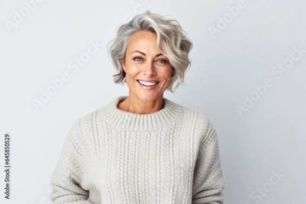 Obraz Medium shot portrait photography of a Swedish woman in her 50s wearing a cozy sweater against a white background