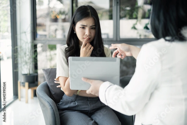Fototapeta Female CEO and businesswoman meeting to discuss business plan displayed on screen laptop analyze and calculate planning strategies. business success process