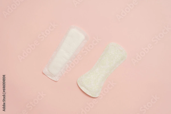 Fototapeta Feminine sanitary napkins (sanitary pads) on pink background