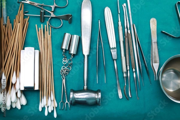 Obraz Top view  Surgical tools and equipment on green cloth. Sterilized