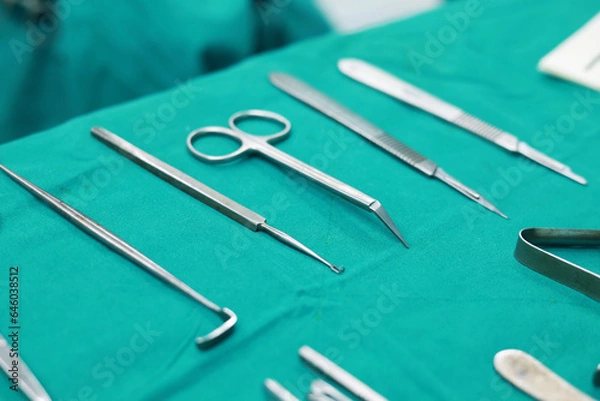 Obraz Soft focus Surgical tools and equipment on green cloth. Sterilized