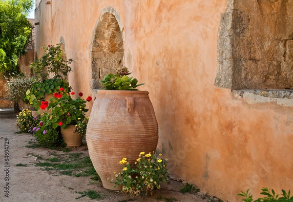 Obraz Цветы на фоне стены старого дома. Греция. Крит