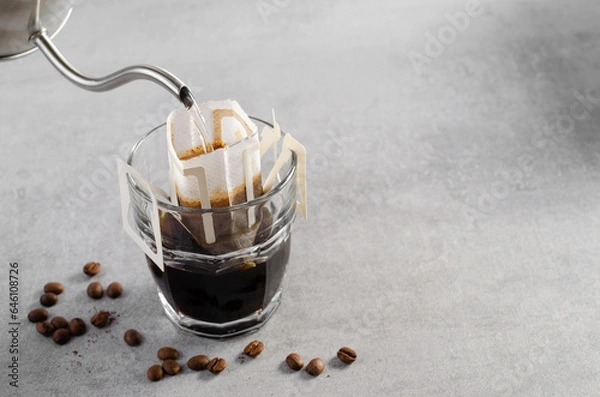 Fototapeta Drip Coffee Bag in a Cup, Quick Way to Brew Ground Coffee Using Paper Type Filter