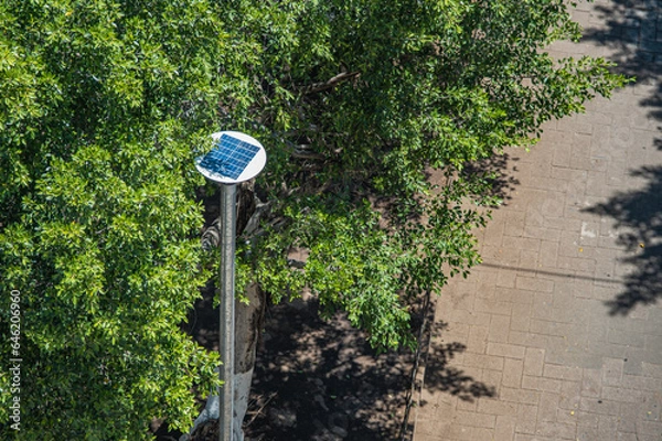 Obraz Lamp with solar panel in ecological park