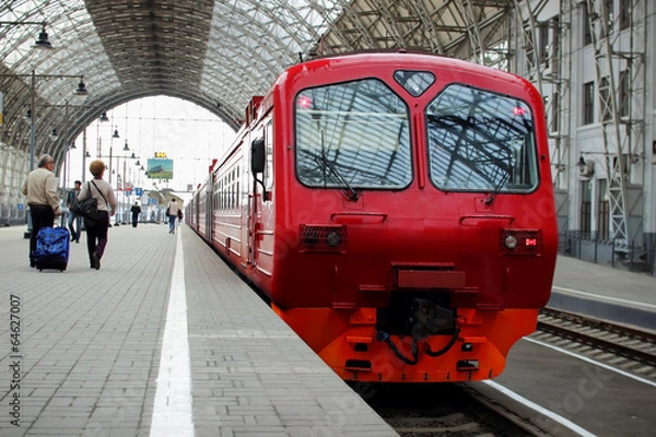 Obraz Passenger train is on the platform.