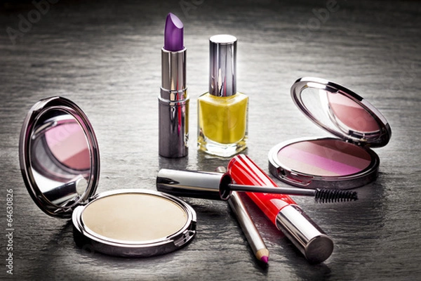 Obraz Cosmetics on black slate background