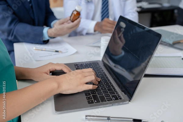 Fototapeta Joint meeting between doctors and administrators, meeting summarizing the prescription of medicines and importing medicines for use in hospitals, meeting to discuss together. Doctor meeting concept.