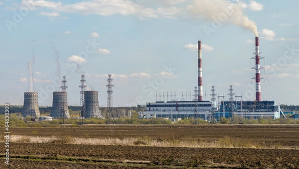 Fototapeta Heat Electric Station with the plowed field in the foreground