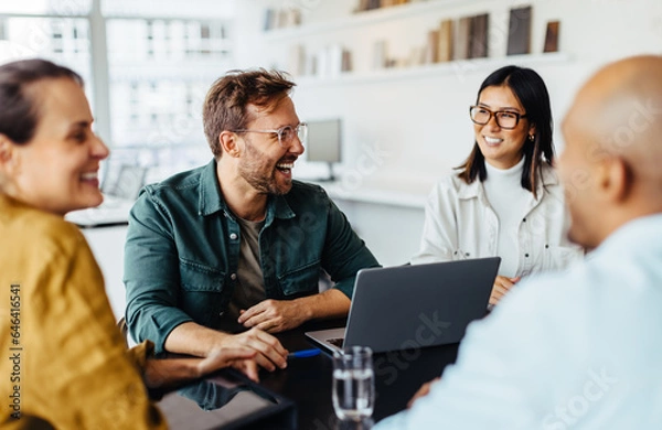 Obraz Diverse business people having a team meeting in an office