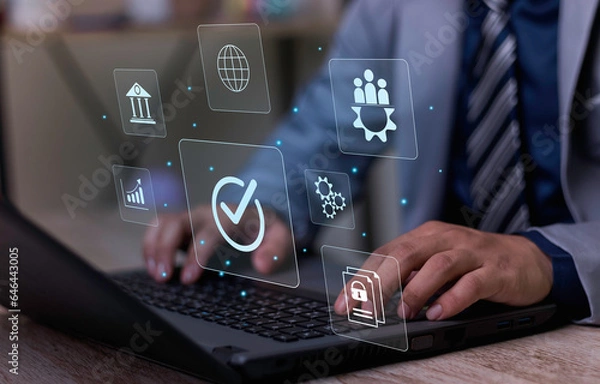 Fototapeta Businessman working on computer and showing the sign top Quality Assurance Standard Assurance ISO Certification and Standards Concept Satisfaction with products and services.