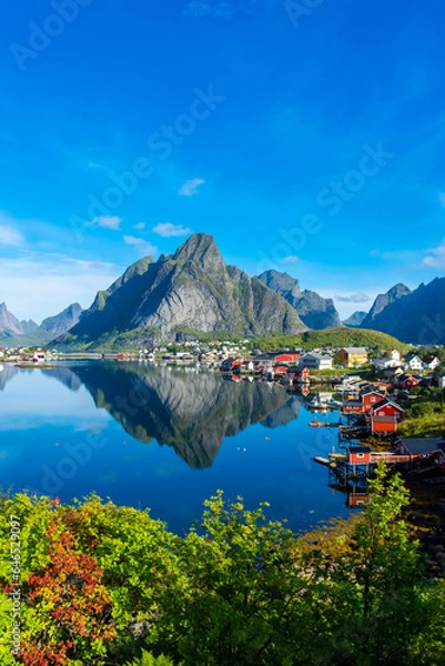 Fototapeta Perfect reflection of the Reine village on the water of the fjord in the Lofoten Islands,  Norway