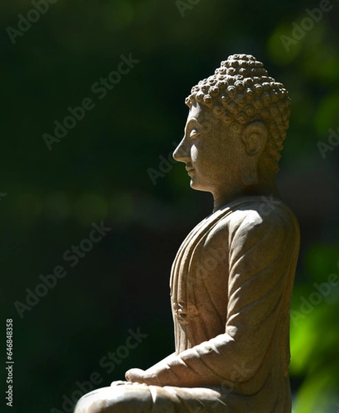 Obraz The face of the stone Buddha In the garden of a Buddhist temple