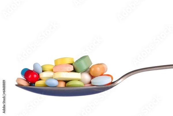 Fototapeta Pills on Teaspoon