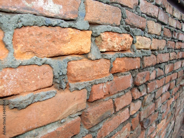 Obraz old brick wall with half distroyed brick