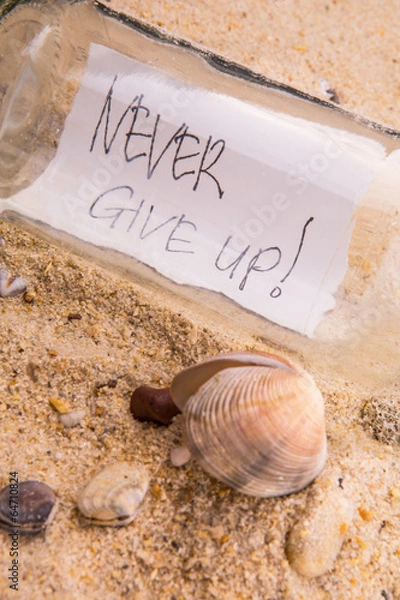 Fototapeta Concept image of a message NEVER GIVE UP in a bottle