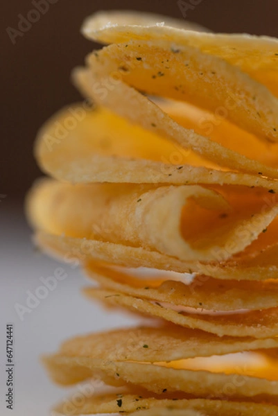 Fototapeta Potato chips on a light background