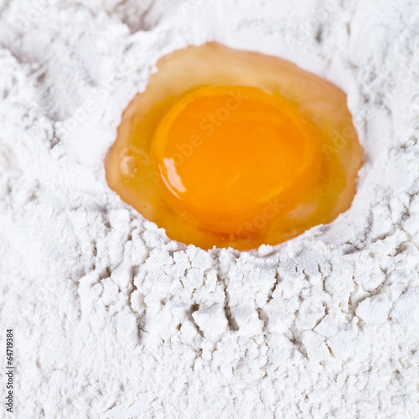 Obraz broken egg on flour