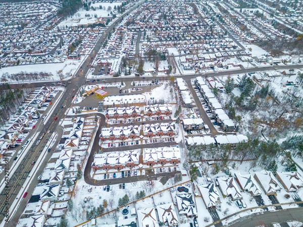 Fototapeta Experience the raw power and serene beauty of a winter storm in Barrie, Ontario through captivating drone views. This stunning footage captures the icy transformation of the landscape, as snow blanket
