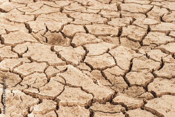 Fototapeta Dry and cracked land,Dry cracked ground during drought.Effects of climate change such as desertification and droughts.