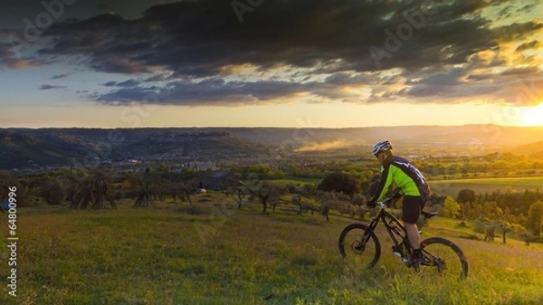 Obraz ciclista in bicicletta al tramonto
