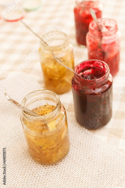 Fototapeta different jars full of fruity jam