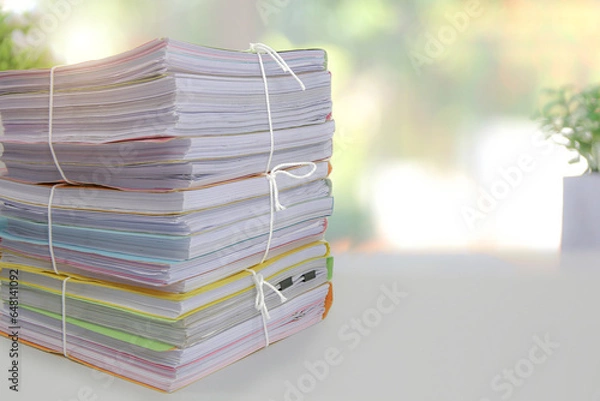 Obraz Pile or heap of financial business document paperwork stack on office desk concept of workload overtime or workplace paperless copy