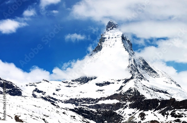 Fototapeta Panoramic view on Snow Mountain and cloudy with blue sky at Matterhorn Zermatt Switzerland