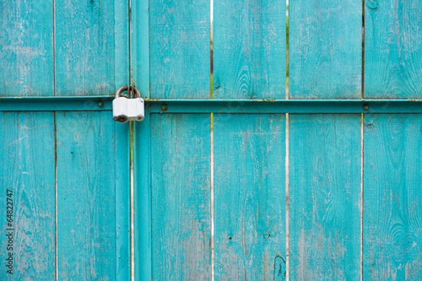 Fototapeta Wooden gate with padlock