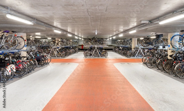 Obraz Underground bicycle parking. Many bicycles in the two-level parking lot