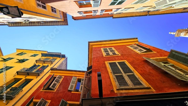 Fototapeta View of buildings and architecture, walls and windows architecture in Nice in the south of France. Old city Cote d'Azur, France on the French Riviera.