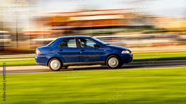 Fototapeta 22 april 2023.Bialystok.Poland.Paning shot -car in motion with a blurred background.