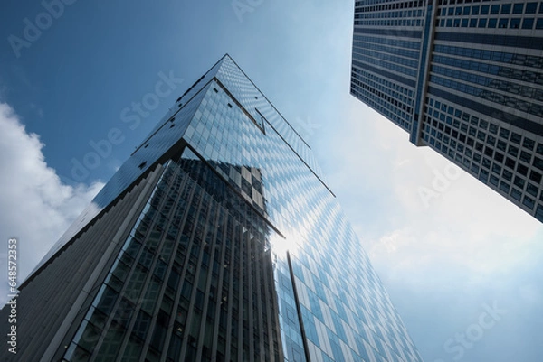 Obraz Exterior view of high-rise building against the blue sky