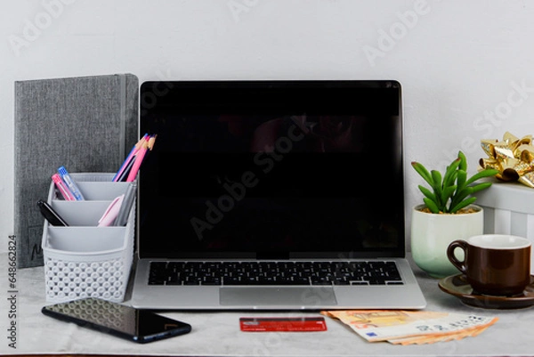 Fototapeta Laptop, money and credit card for purchases on the table. Cyber Monday sale online