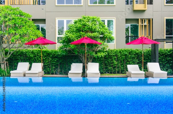 Fototapeta Daybed by the pool with residents.