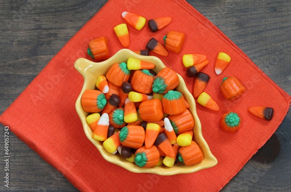 Obraz Candy corn and candy pumpkins top view.