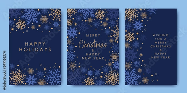 Fototapeta Samples of modern decorative art. Merry Christmas and New Year cards and invitations to corporate events. Blue and gold snowflakes and a Christmas star on a blue background. Winter vector illustration