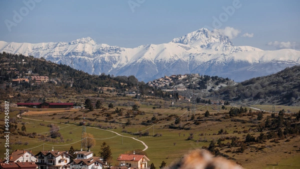 Fototapeta Beautiful view of the town of Ovindoli. Beautiful view of the Apennines. The road comes almost to the observation point.
