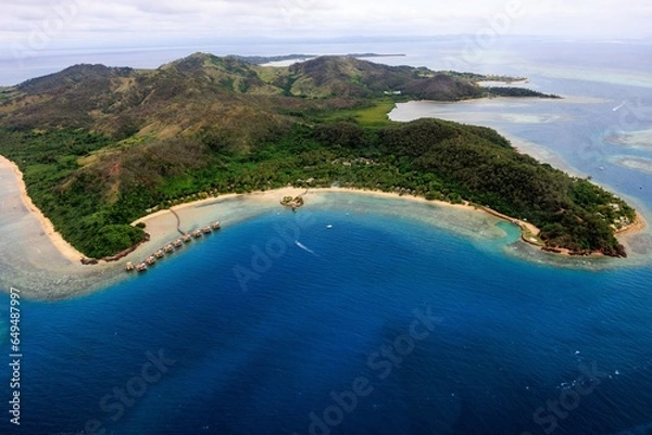 Fototapeta aerial view of a fiji resort on the ocean with island in the background
