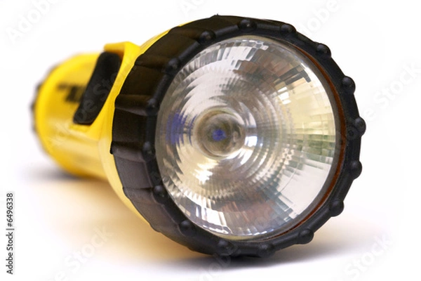 Obraz Yellow and black flashlight with white background
