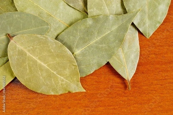 Fototapeta Bay leaf on the table. A popular spice used in cooking.