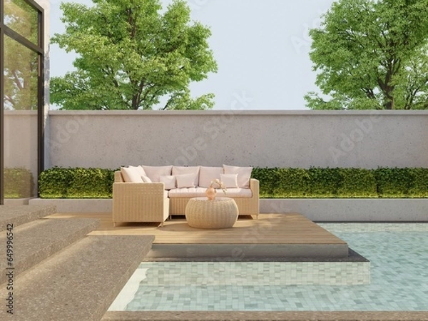 Fototapeta Outdoor swimming pool seating area evening sun with beige rattan sofa set and the green bushes.3d render