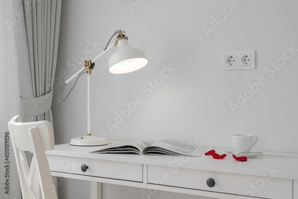 Fototapeta Glowing table lamp on the table