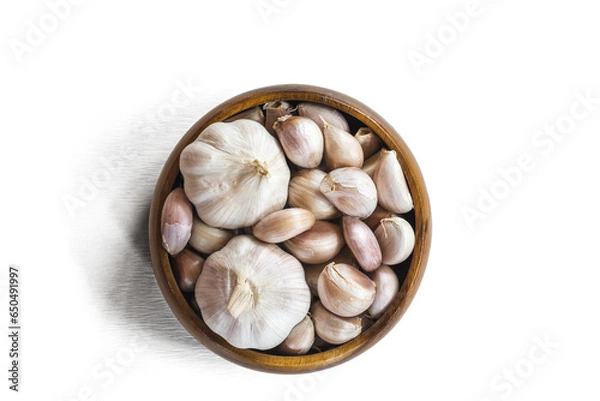 Obraz Garlics in wooden bolw  on white wooden planks background.  have path